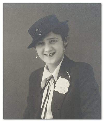 Aunt Adel smiling with Hat and Flower