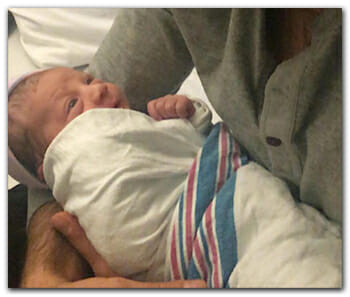 Fertile Heart Father holding newborn
